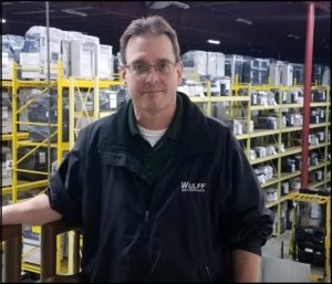 Steve, Sales Rep. in warehouse.